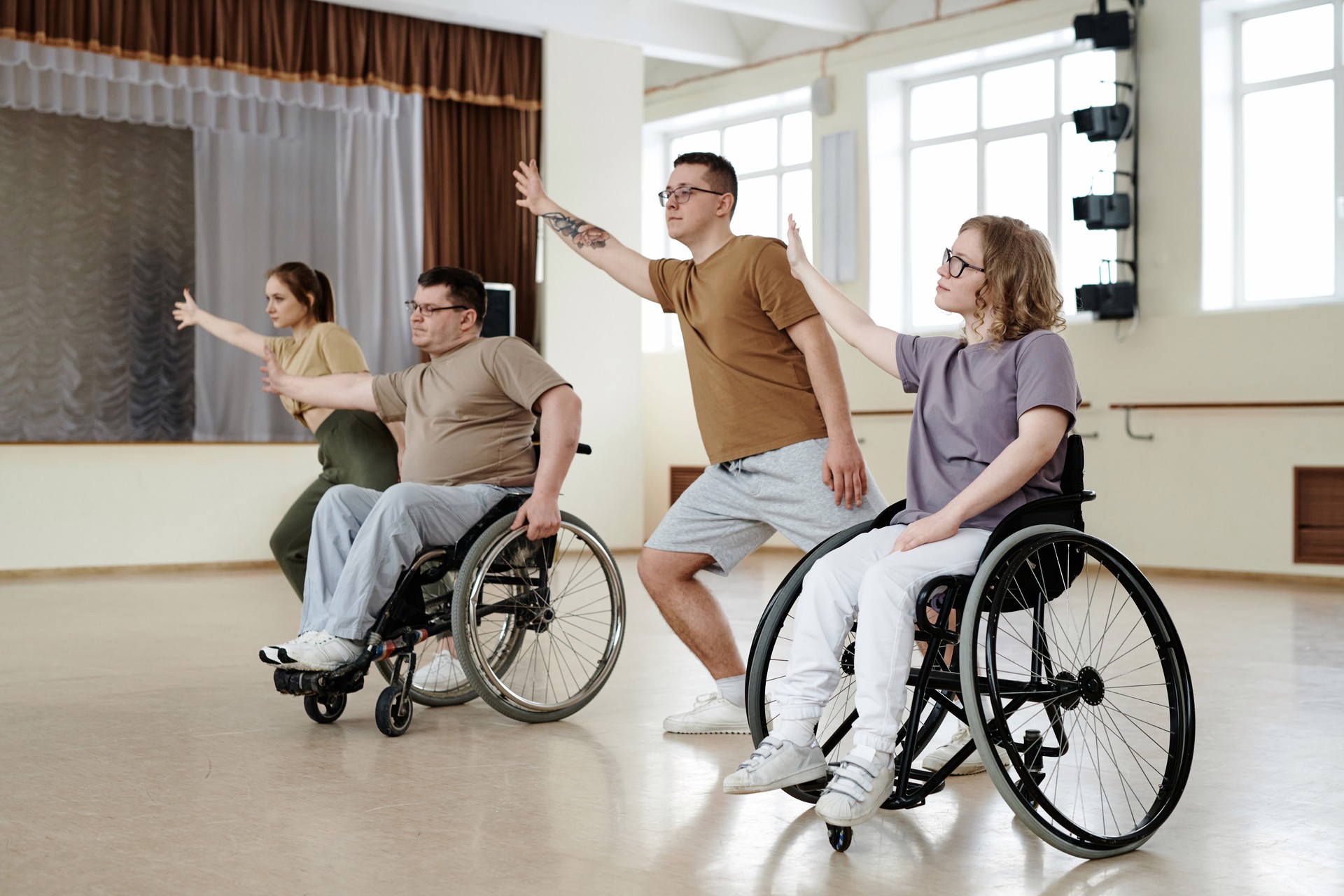 Four Diverse People Dancing In Studio